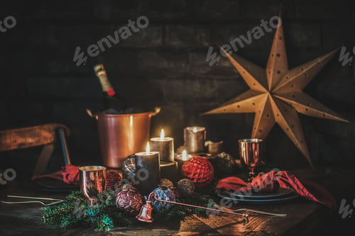 Preview: Christmas festive table setting with champagne, candles, decorations and branches