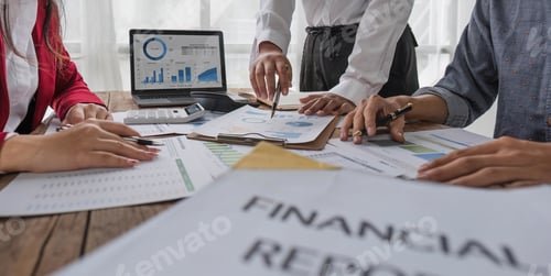 Preview: Business People Meeting using laptop computer,calculator,notebook,stock market chart paper for