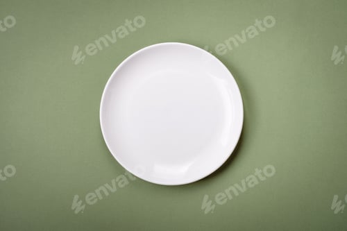 Preview: Empty round ceramic plate on a plain background, flatley with copy space