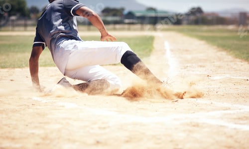 Preview: You cant win without a little dust. Shot of a young man reaching base during a baseball match.