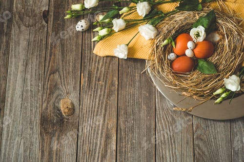 Preview: Easter eggs in a nest on a metal plate on a wooden background.