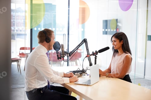 Preview: Young man interviewing a woman in a radio studio