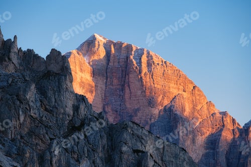 Preview: High cliffs during sunset. Dolomite Alps, Italy. Mountains and clear skies.