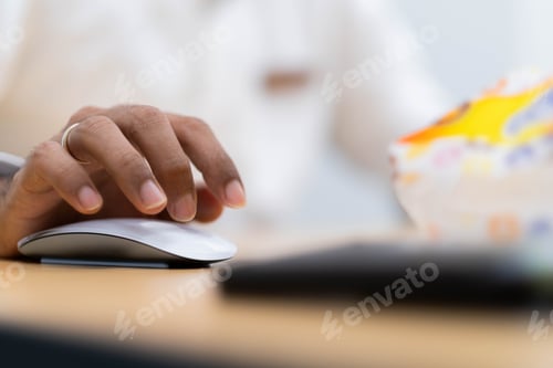 Preview: Person using a computer mouse