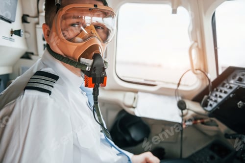 Preview: In oxygen mask. Pilot on the work in the passenger airplane. Preparing for takeoff