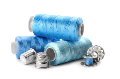 Preview: Color threads and sewing accessories on white background