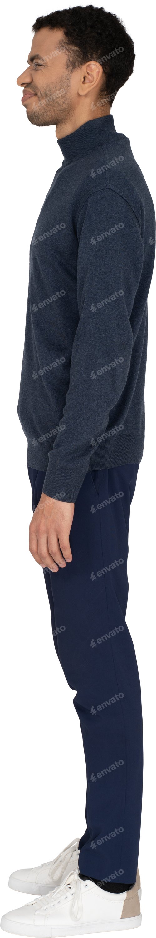 Preview: a man is standing with his hands in his pocket