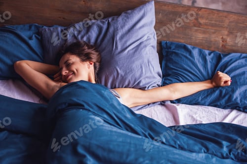 Preview: Young woman in bed