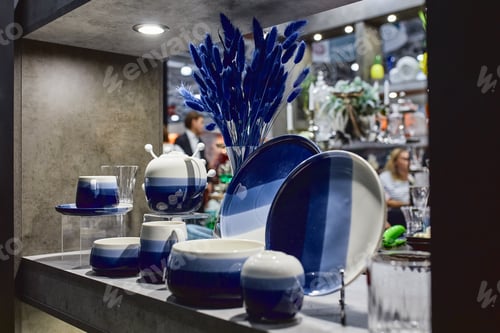 Preview: a showcase with the laying of porcelain dishes. Beautiful merchandising, dishes for restaurants and
