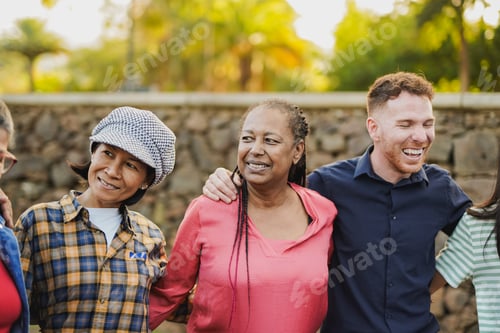 Preview: Group of multi generational people hugging each other outdoor with city park in background