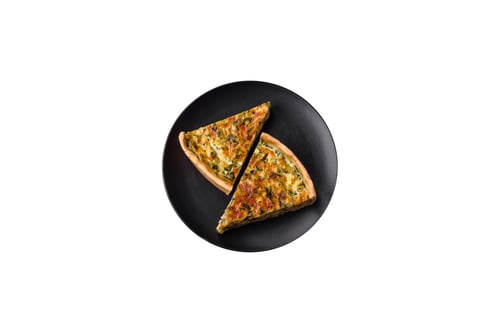 Preview: Delicious fresh quiche with broccoli, cheese, spices and herbs cut into pieces