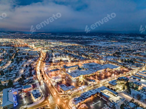 Preview: Drone shot of buildings in Kelowna, British Columbia, Canada in the evening