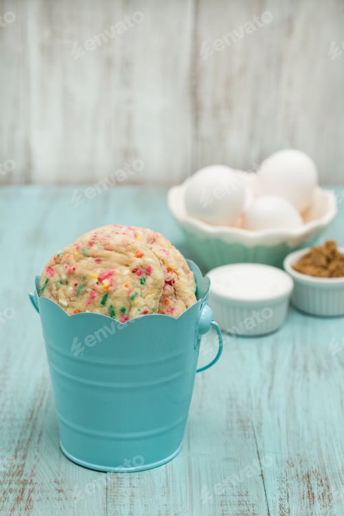 Preview: Blue Tin Full Of Confetti Cookies With Eggs And Sugars