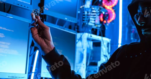 Preview: A male hacker is using a computer to hack data to demand ransom from victims.