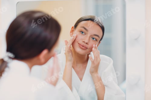 Preview: Young caucasian woman doing facebuilding yoga facial gymnastics self lymph facelift massage