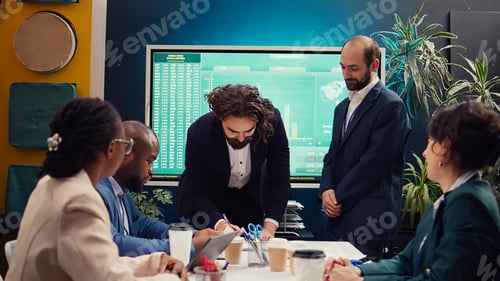Preview: Business administrators shaking hands and signing a new contract
