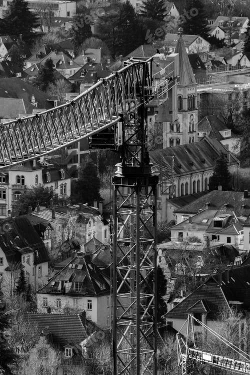 Preview: Vertical grayscale shot of a crane in Neuenheim, Germany
