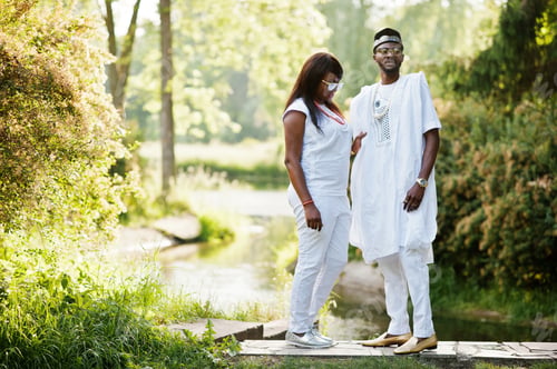 Preview: Rich african couple at white national dress and sunglasses