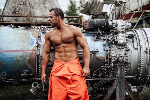 Preview: Mechanic macho with muscular build in orange clothing