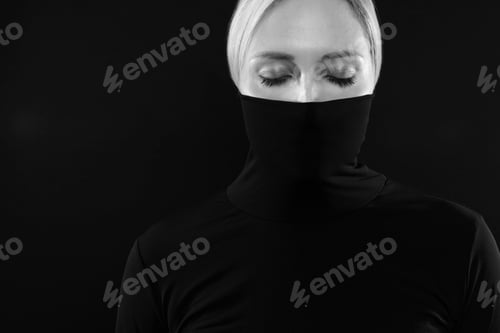 Preview: Black and white portrait of woman hiding face in black turtleneck