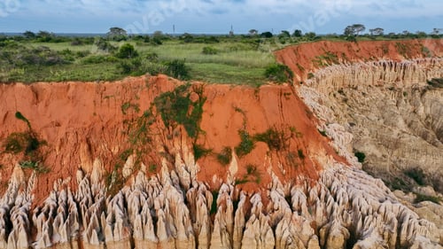 Preview: Breathtaking lunar-like landscape in Angola showcasing unique rock formations and rich red soil