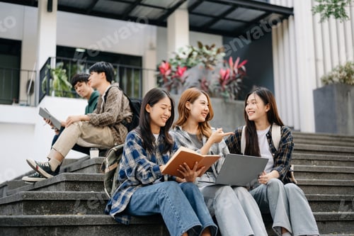 Preview: Three young Asian college students and a female student group work at the campus park