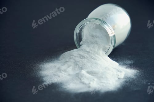 Preview: Glass bowl of baking soda. Spoonful of bicarbonate.