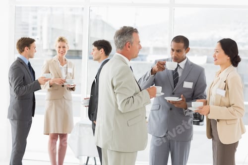 Preview: Business People Chatting And Drinking Coffee At A Conference In The Office