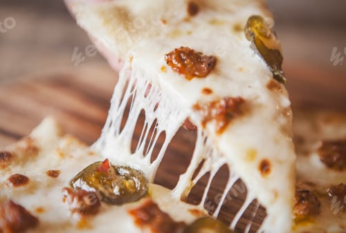 Preview: Grabbing a cheesy slice of pizza.