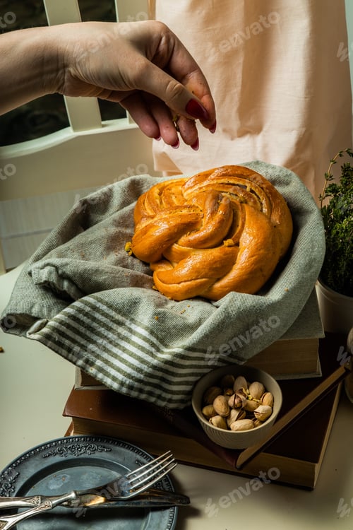 Preview: homemade buns with cream and pistachio cream decorated with thyme freshly baked for breakfast