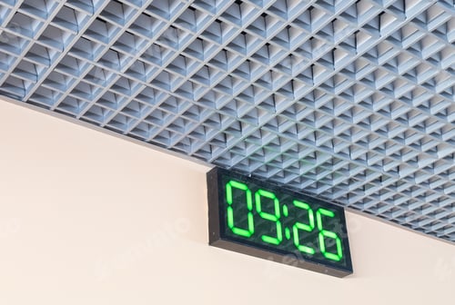 Preview: Digital clock in airport terminal.