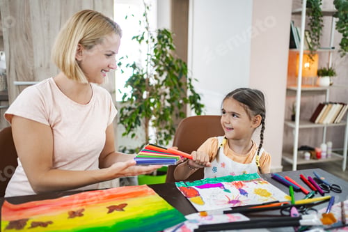 Preview: Mother and daughter engaged in creative art activity