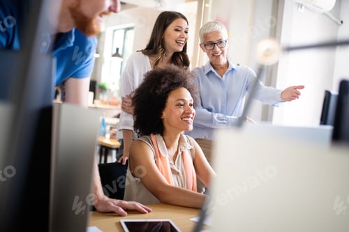 Preview: Successful group of business people at work in office