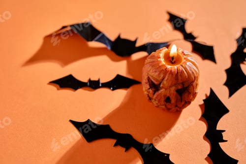 Preview: Halloween-style candles on a orange background. Festive decor.