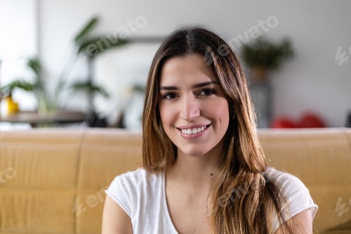 Preview: Close up portrait of smiling young adult pretty woman looking at camera