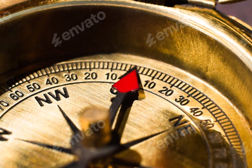 Preview: Golden brass compass closeup with north direction