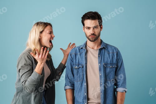 Preview: Young caucasian displeased man and woman having argument