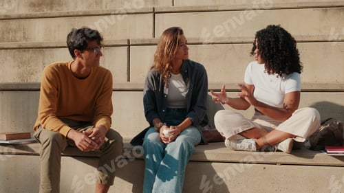 Preview: Friends Sharing Conversation On Outdoor College Steps