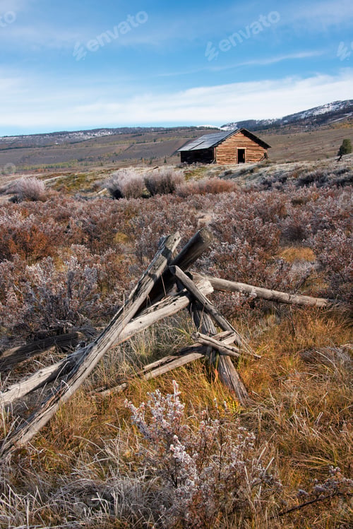 Preview: Broken fencing on grassland, and a barn in the open in the Green River lakes area.