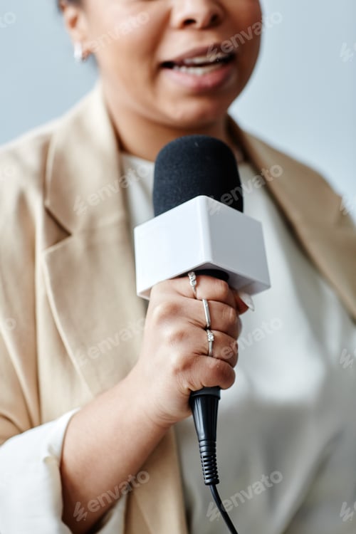 Preview: Female Journalist Holding Mic