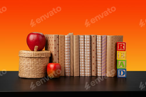 Preview: Stack of books on black wooden table