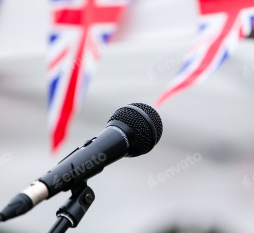 Preview: Microphone and union jack bunting at one of the concert stands at Garth Park, Bicester