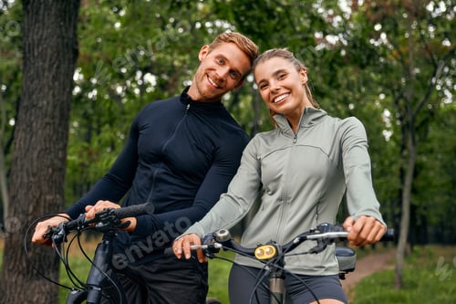 Preview: An Active Couple Enjoying a Wonderful Day of Biking Together Amidst Beautiful Nature