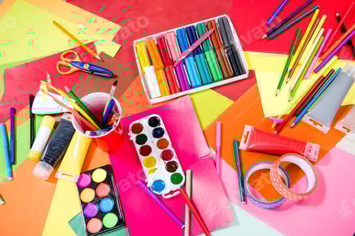 Preview: Top view of colorful school supplies on table