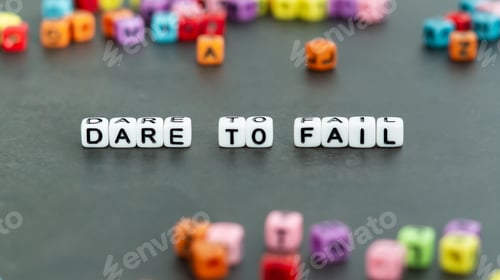 Preview: Dare to fail slogan in white block bead letters. Motivation inspiration cheer up concept