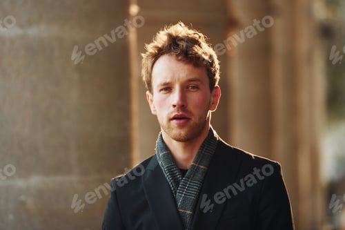 Preview: Portrait of elegant young man in formal classy clothes that outdoors in the city