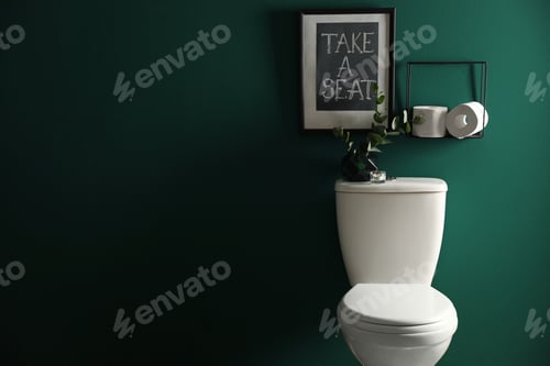 Preview: Decor elements, paper rolls and toilet bowl near green wall, space for text. Bathroom interior
