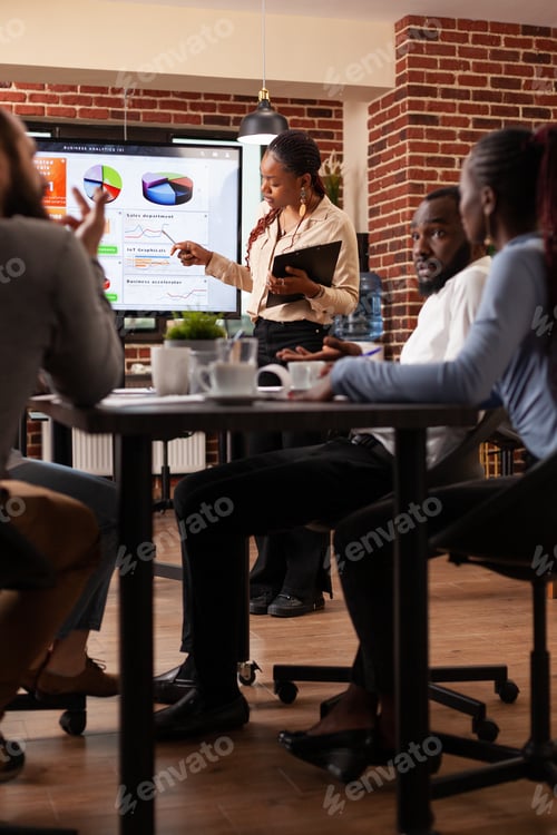 Preview: African american manager showing marketing presentation