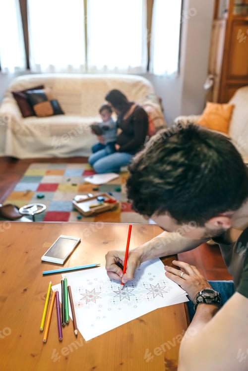 Preview: Young man coloring mandalas