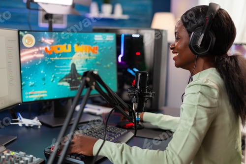 Preview: Excited professional african e sports player during stream of competition